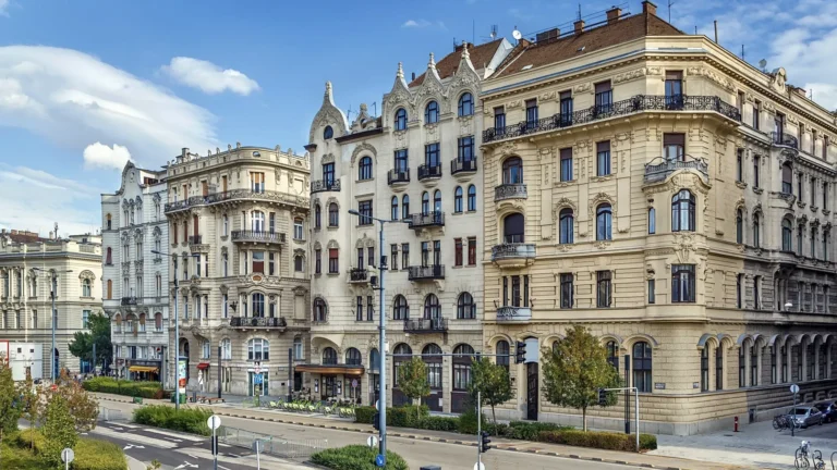 Daytime view of residential apartment buildings on a Budapest street
