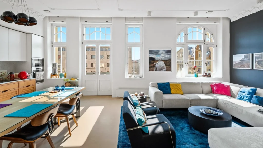 Bright Budapest apartment interior with high ceilings, large windows and elegant period details