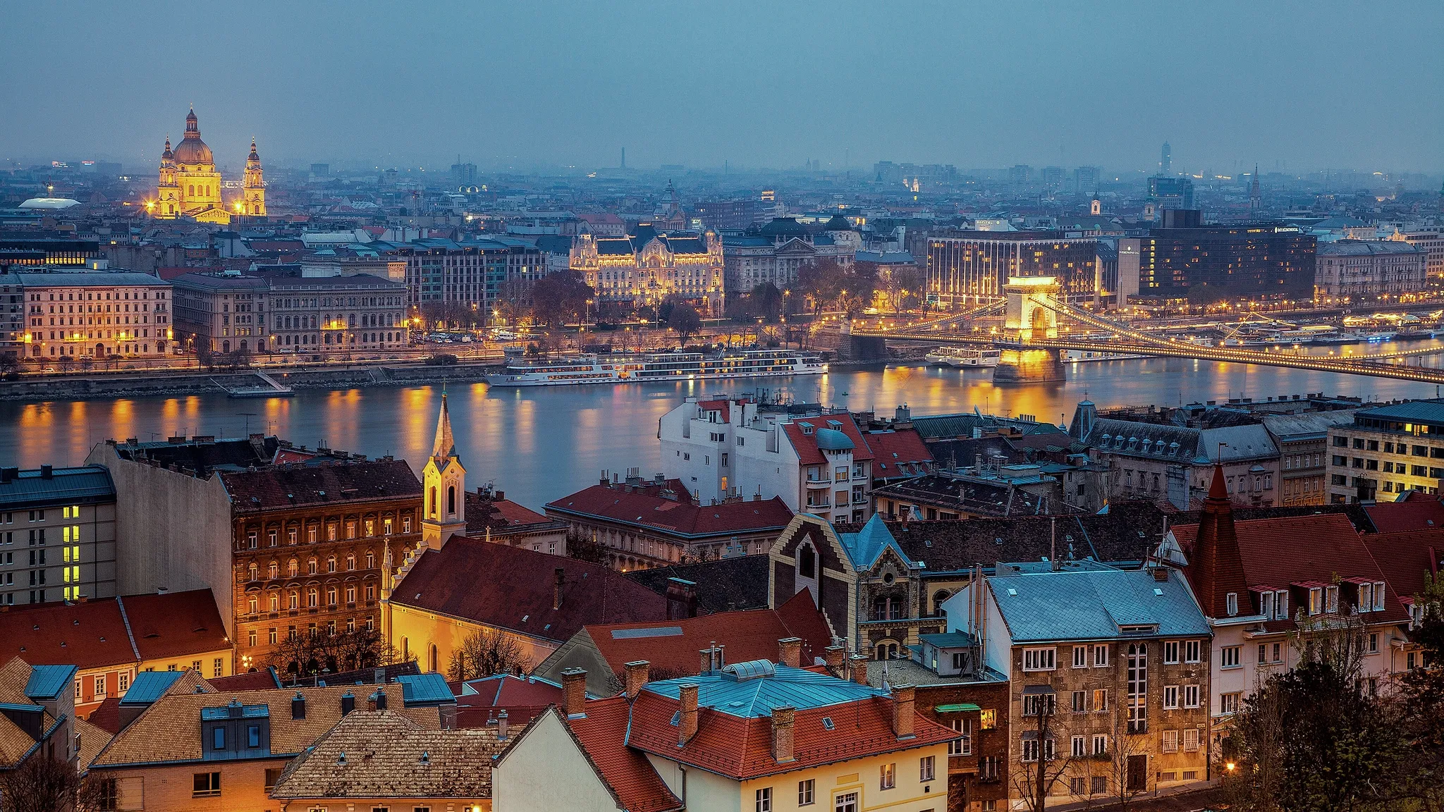 Panoramic evening view of Budapest showing Buda, the Danube, Chain Bridge and the residential districts of Pest